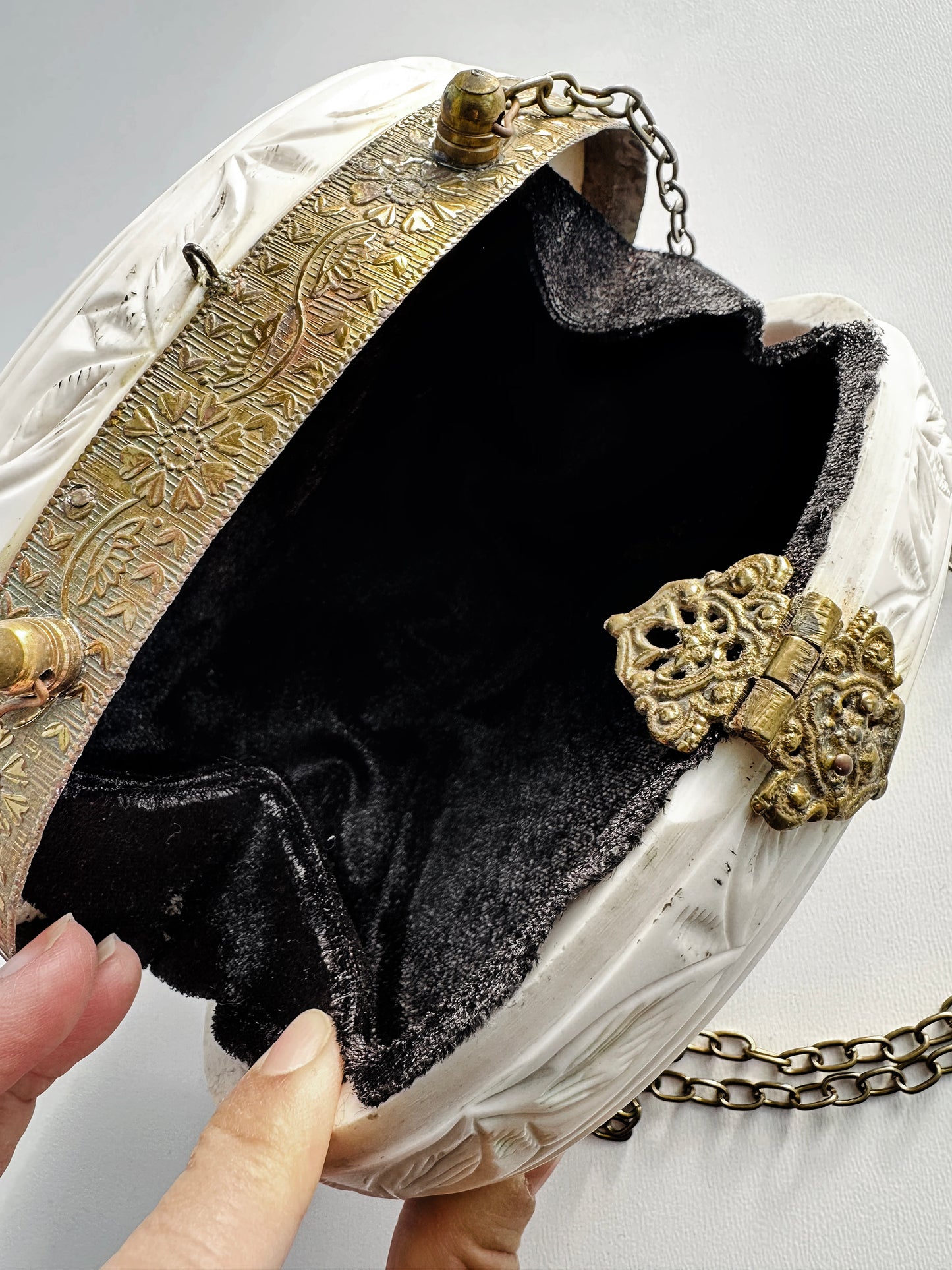 Vintage 1960s Mid-Century Carved Celluloid Oval Clutch with Etched Floral and Leaf Motif Metal Frame