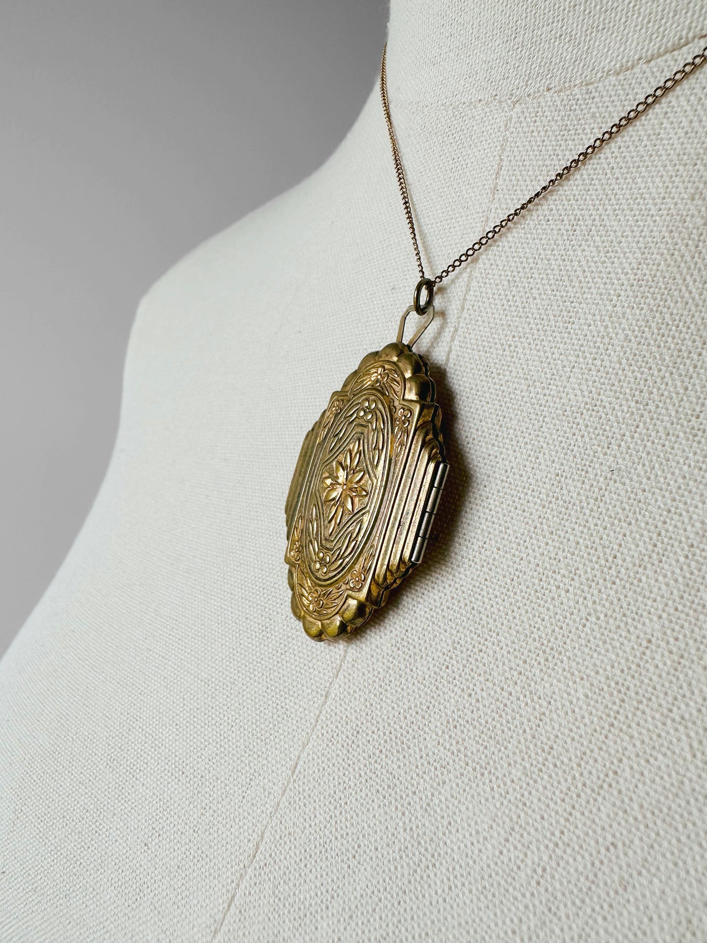 Antique 1920s - 1930s Tarnished Gold-Toned Locket Necklace with Floral Relief