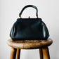 1940s - 1950s Black Leather Handbag with Brass Accents