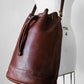 1970s Saddle Brown Buttery Soft Leather Cinch Top Bucket Crossbody Bag