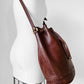 1970s Saddle Brown Buttery Soft Leather Cinch Top Bucket Crossbody Bag