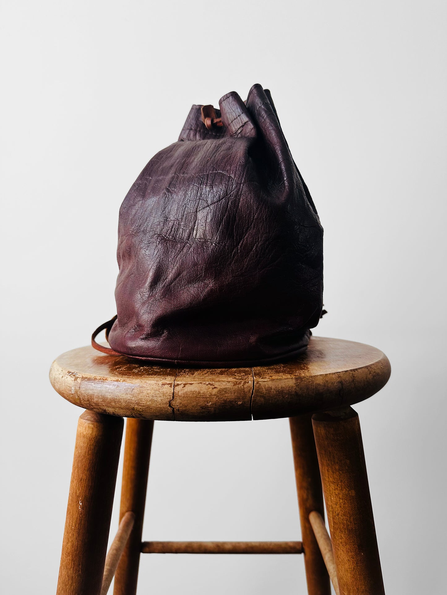 Vintage 1970s Eggplant Tan Leather Cinch Top Backpack Bag