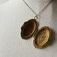 Antique 1920s - 1930s Tarnished Gold-Toned Locket Necklace with Floral Relief