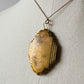 Antique 1920s - 1930s Tarnished Gold-Toned Locket Necklace with Floral Relief