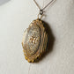 Antique 1920s - 1930s Tarnished Gold-Toned Locket Necklace with Floral Relief