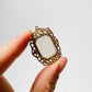 1920s Art Deco Filigree Gold-Toned Camphor Glass Pendant