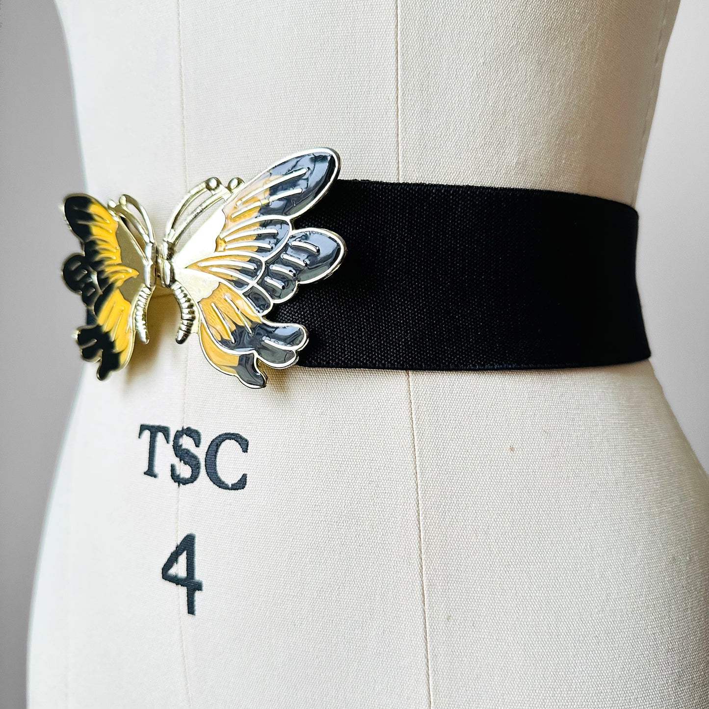 1980s Black Stretch Waist Adjustable Enamelled Metal Butterfly Belt