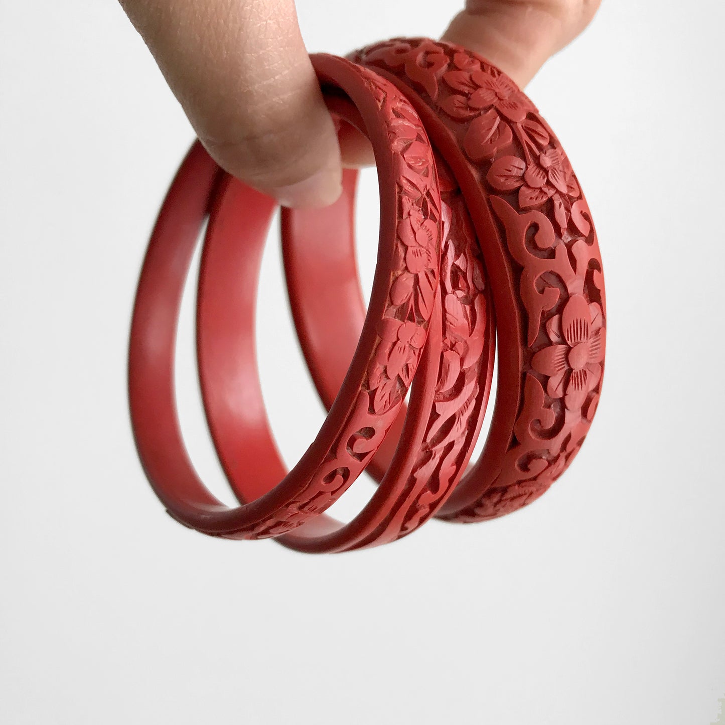 Antique early 1900s, Red Chinese Cinnabar Floral Carved Bangle Bracelet Set