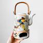 1980s Made in Korea Bird on a Branch Patterned Ceramic Teapot with Warming Base